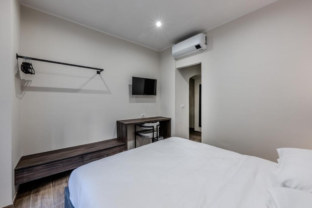 Postel nebo postele na pokoji v ubytování Soziglia Guest Rooms