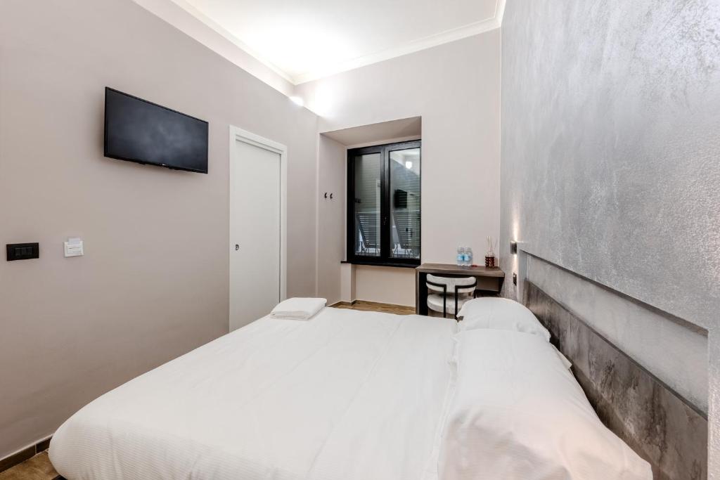 Postel nebo postele na pokoji v ubytování Soziglia Guest Rooms