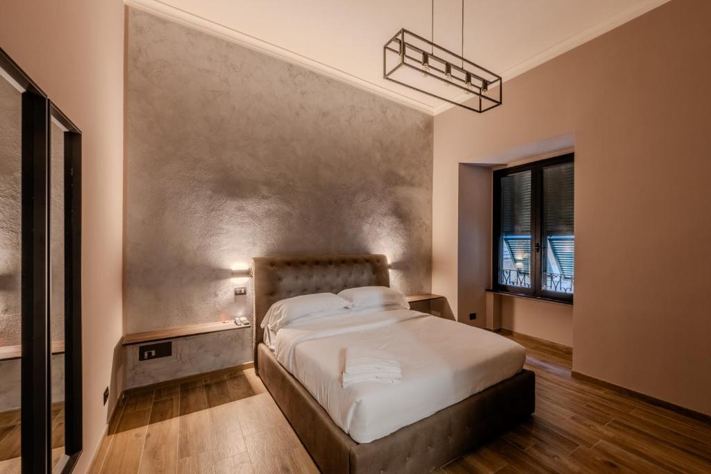 Postel nebo postele na pokoji v ubytování Soziglia Guest Rooms