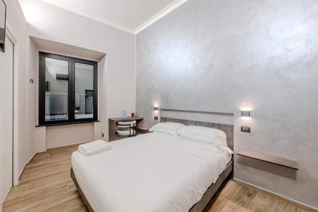 Postel nebo postele na pokoji v ubytování Soziglia Guest Rooms