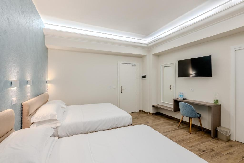 Postel nebo postele na pokoji v ubytování Soziglia Guest Rooms