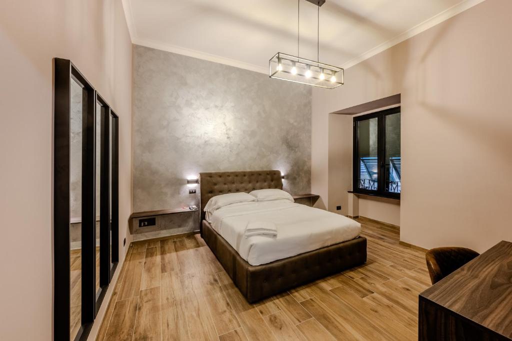 Postel nebo postele na pokoji v ubytování Soziglia Guest Rooms