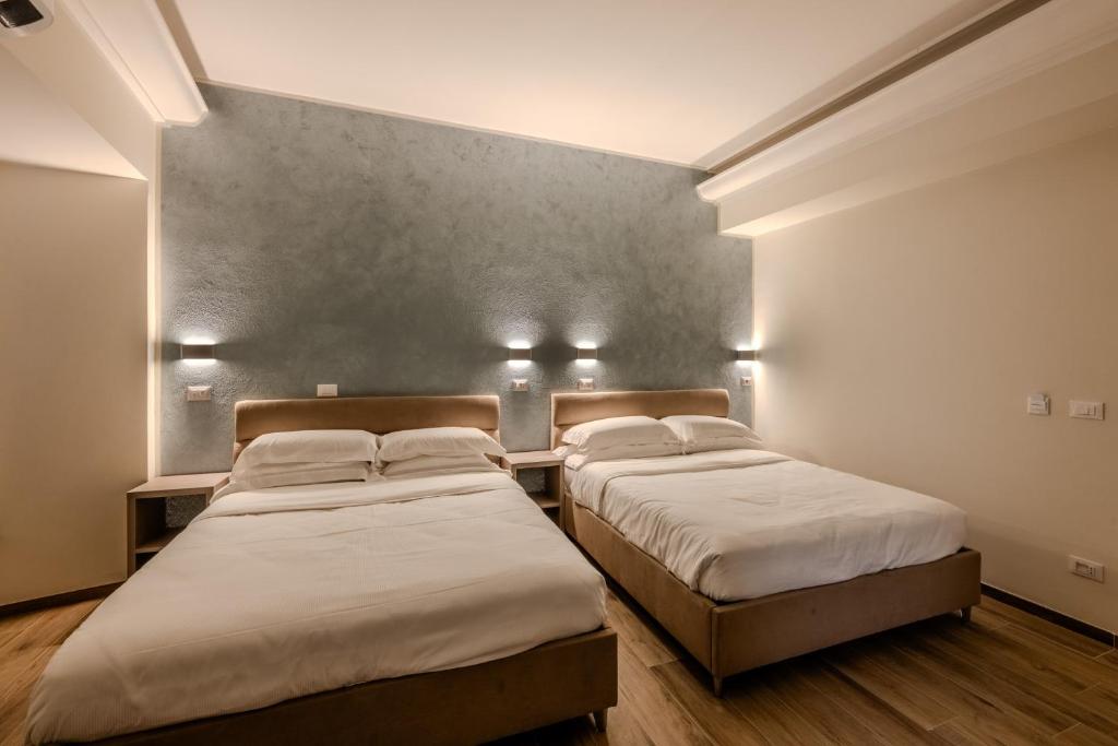 Postel nebo postele na pokoji v ubytování Soziglia Guest Rooms
