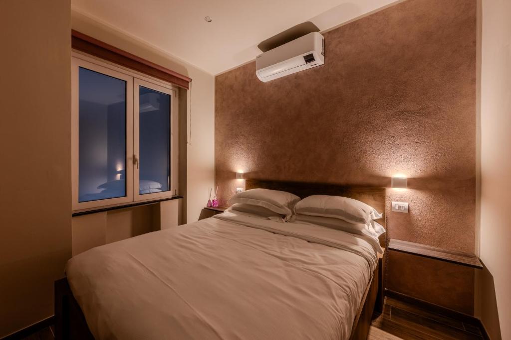 Postel nebo postele na pokoji v ubytování Soziglia Guest Rooms