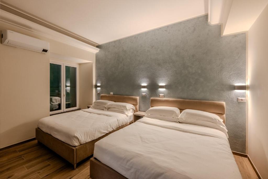 Postel nebo postele na pokoji v ubytování Soziglia Guest Rooms