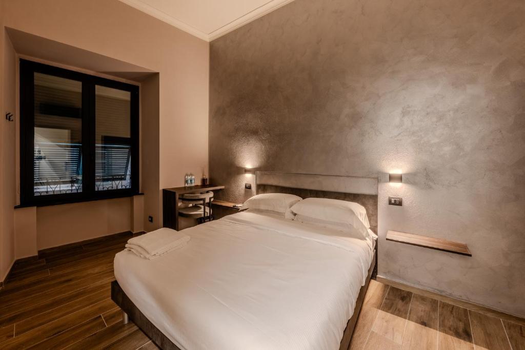 Postel nebo postele na pokoji v ubytování Soziglia Guest Rooms