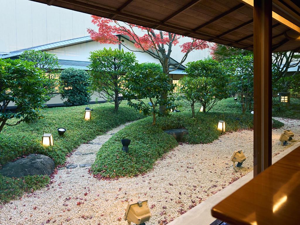 a view of a garden with lights and trees at Hotel Nikko Kumamoto in Kumamoto