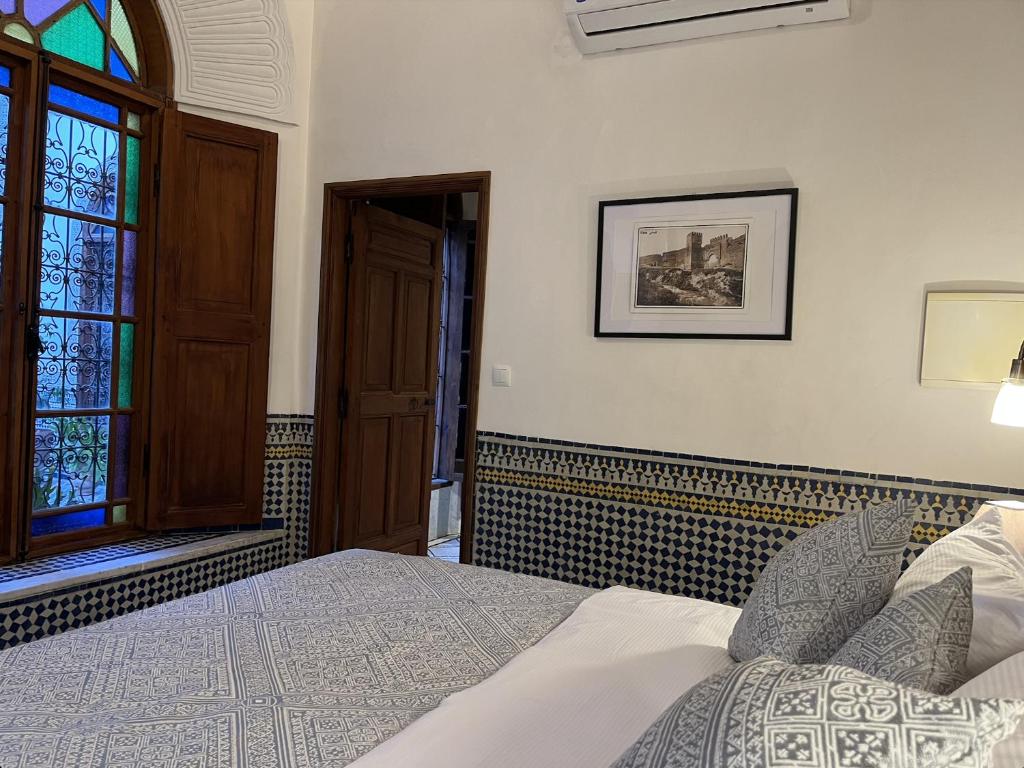 Ένα ή περισσότερα κρεβάτια σε δωμάτιο στο Riad Hanael Garden & Spa