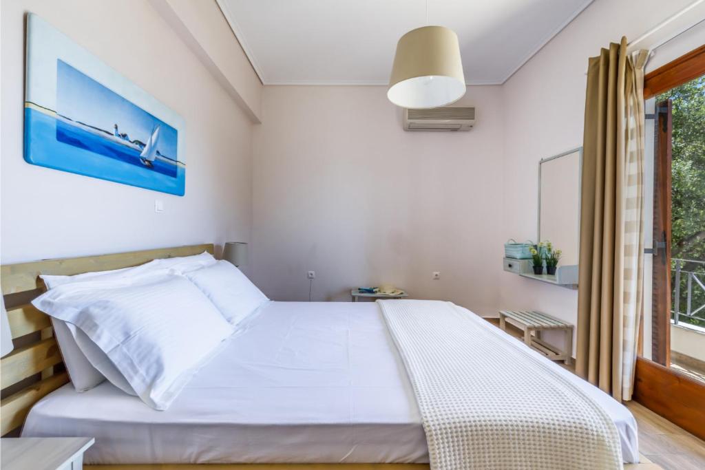 Postel nebo postele na pokoji v ubytování The Sea House Skiathos