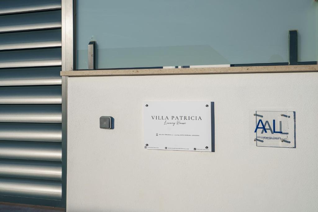 a white door with a sign on it at Villa Patricia in Santa Barbara