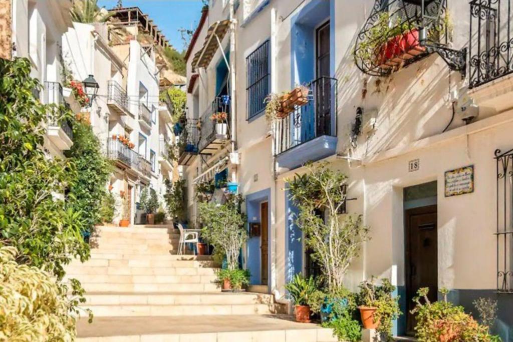 a street in positano with stairs and plants at LovelyLoft Santa Cruz in Alicante