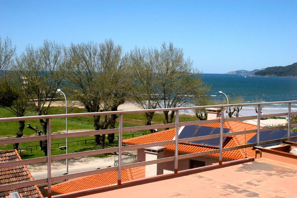 a balcony with a view of the water at Apartamentos Angelito Playa América Ático in Nigrán