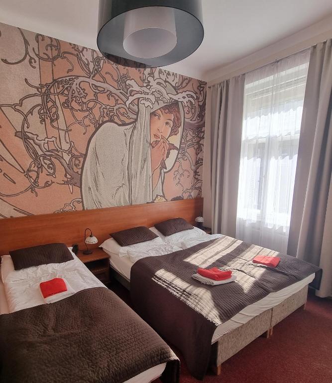 Postel nebo postele na pokoji v ubytování Hotel Klara