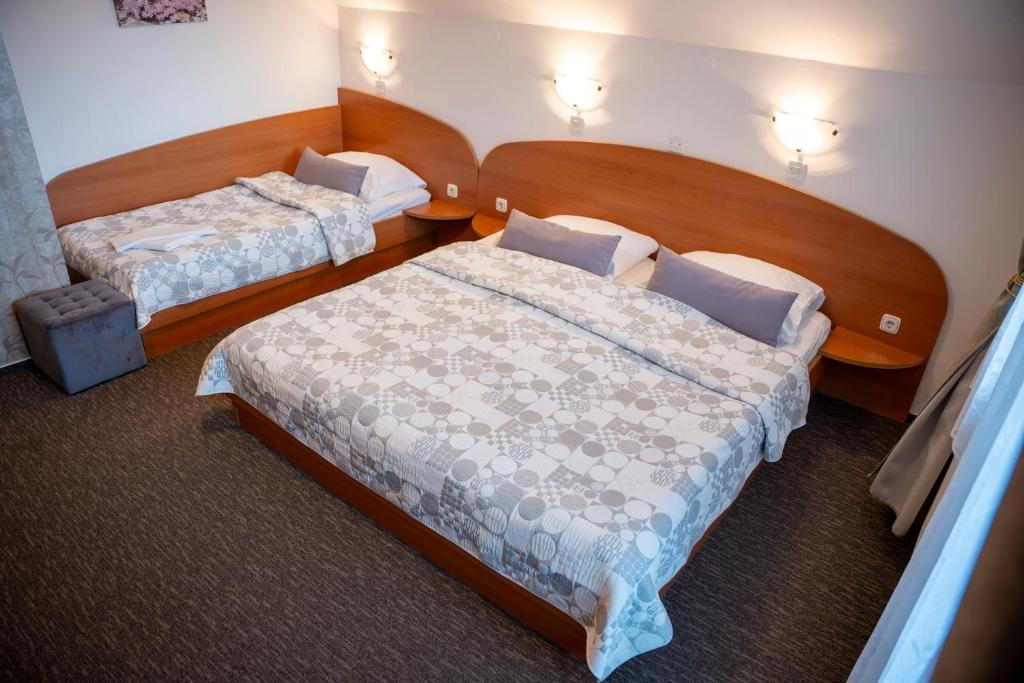 Postel nebo postele na pokoji v ubytování B&B Brezov Gaj