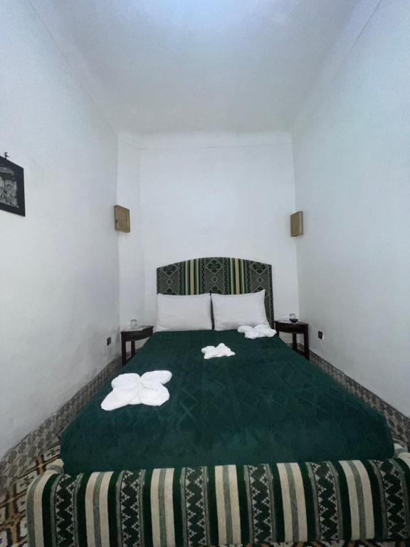 Postel nebo postele na pokoji v ubytování Riad La Perla Bianca