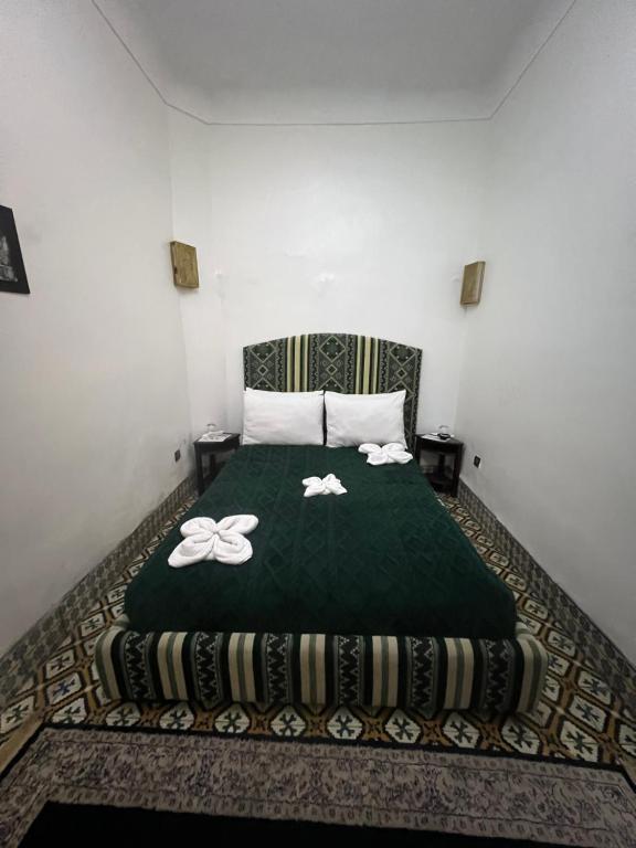 Postel nebo postele na pokoji v ubytování Riad La Perla Bianca