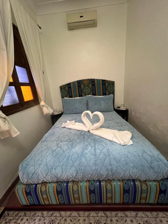 Postel nebo postele na pokoji v ubytování Riad La Perla Bianca