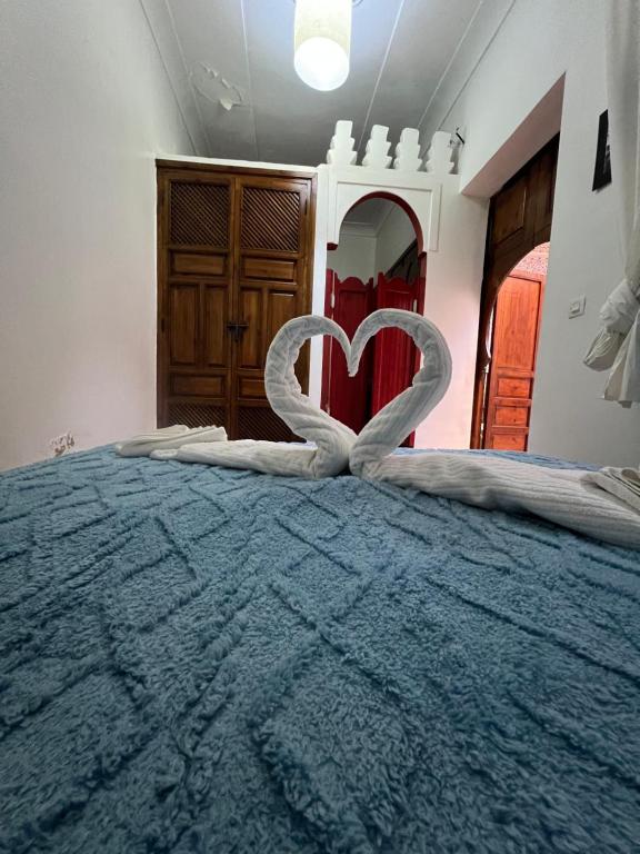 Postel nebo postele na pokoji v ubytování Riad La Perla Bianca