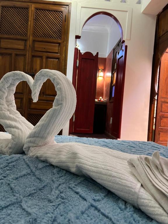 Postel nebo postele na pokoji v ubytování Riad La Perla Bianca