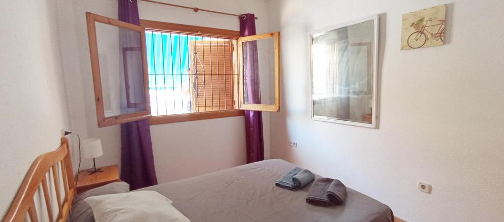 Postel nebo postele na pokoji v ubytování Bungalow Playa La Mata