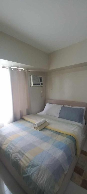 a large bed in a room with a window at Avida Davao Condos, downtown CM Recto Avenue, Davao City in Davao City