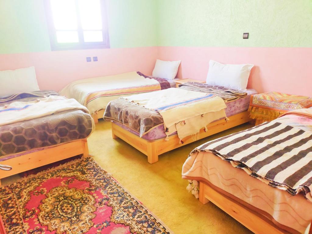 Postel nebo postele na pokoji v ubytování Gîte akioud mazik
