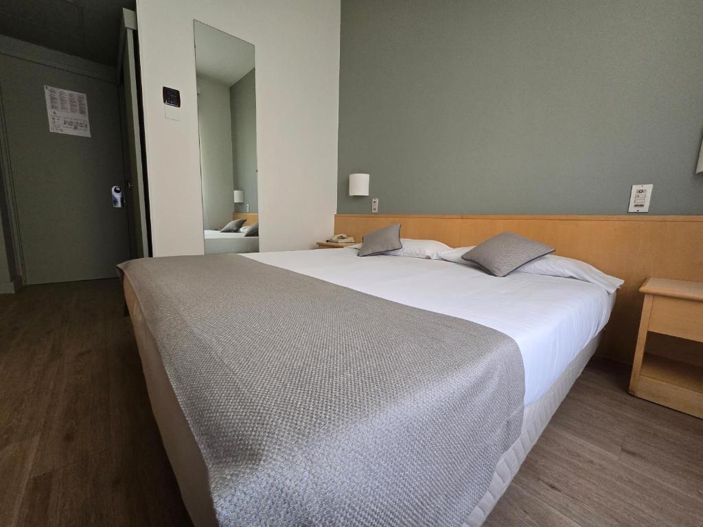 Posteľ alebo postele v izbe v ubytovaní Mokinba Hotels Sant'Ambroeus