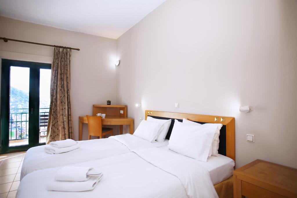 Postel nebo postele na pokoji v ubytování Hotel Lecadin