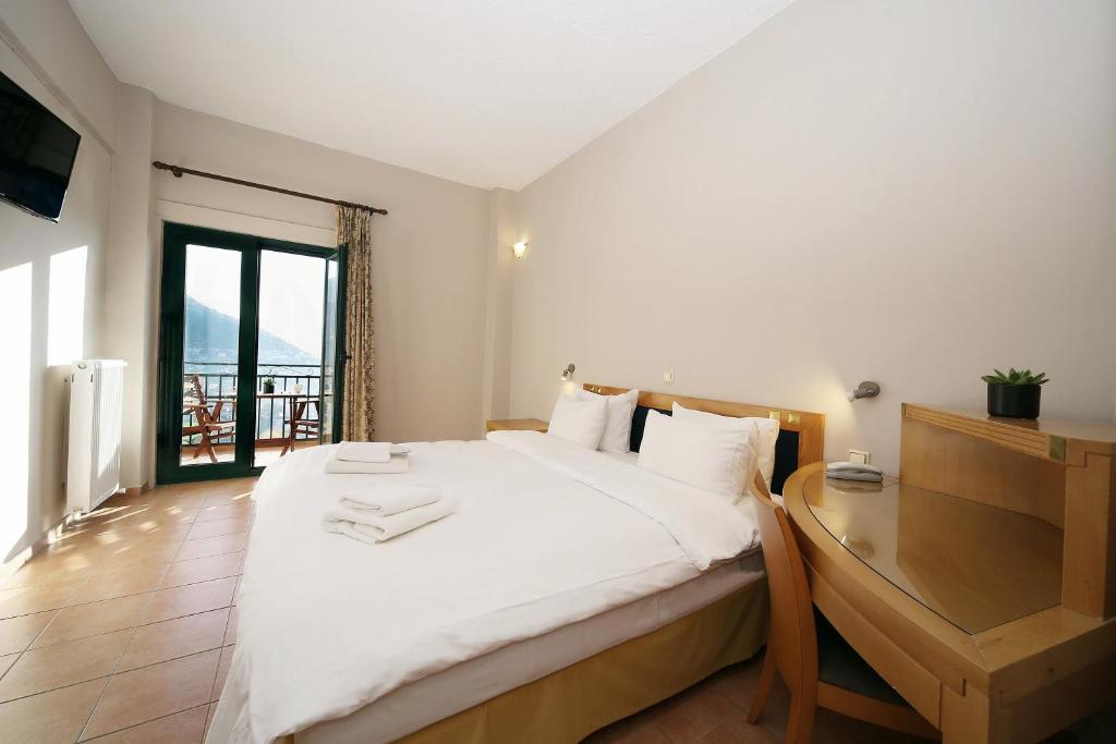 Postel nebo postele na pokoji v ubytování Hotel Lecadin