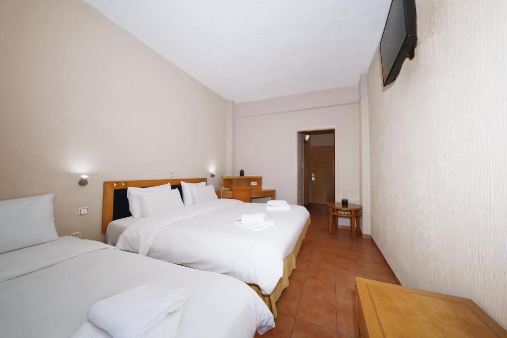 Postel nebo postele na pokoji v ubytování Hotel Lecadin