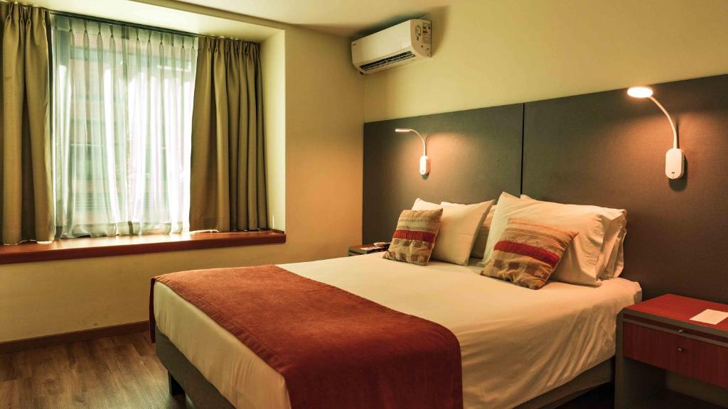 Postel nebo postele na pokoji v ubytování Hotel Eurotel El Bosque