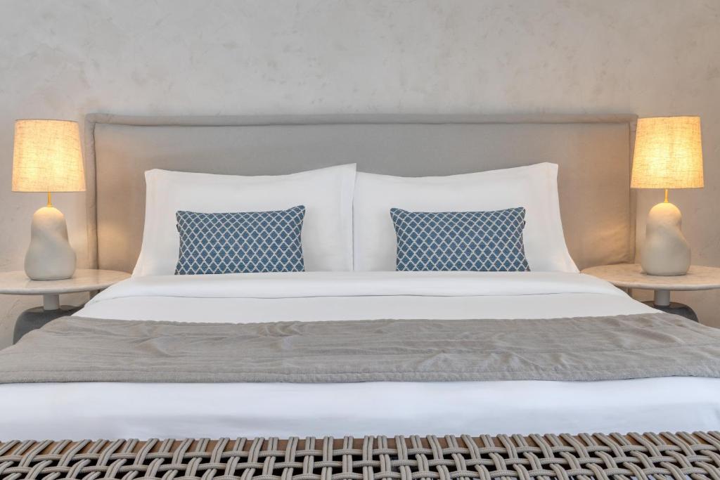 A bed or beds in a room at Patmos Aktis, a Luxury Collection Resort & Spa, Greece