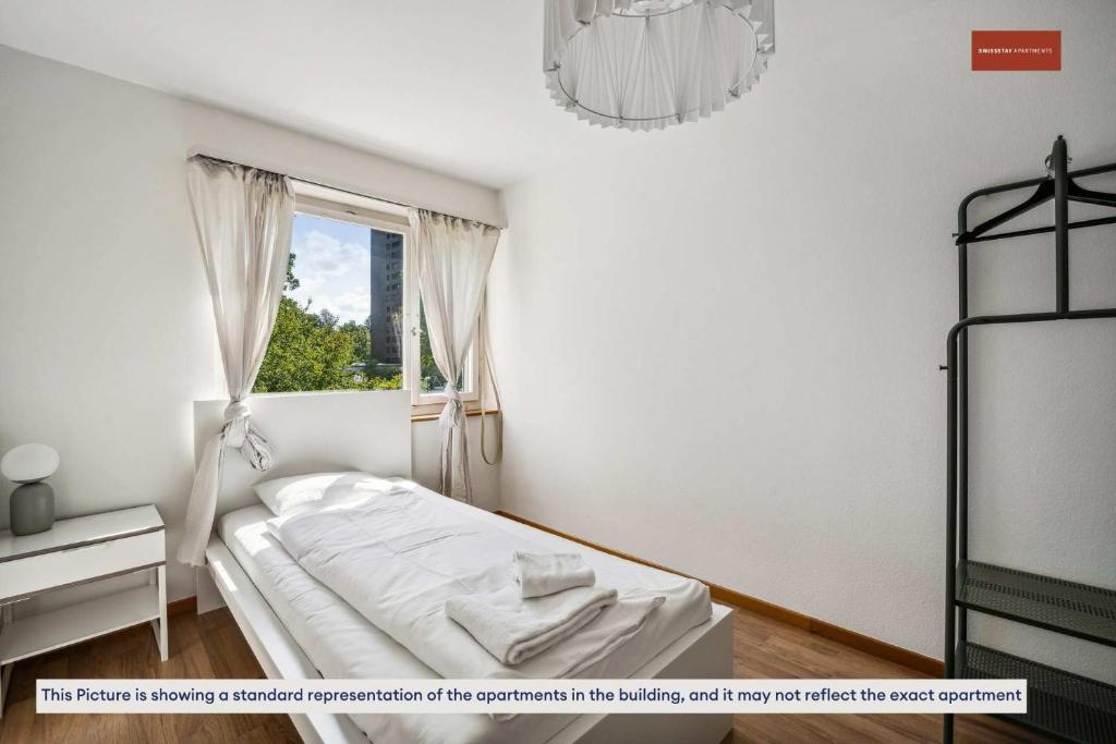 Postel nebo postele na pokoji v ubytování Simple and Cozy Flat in Zurich