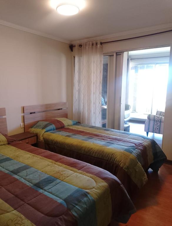 Postel nebo postele na pokoji v ubytování Cabaña familiar