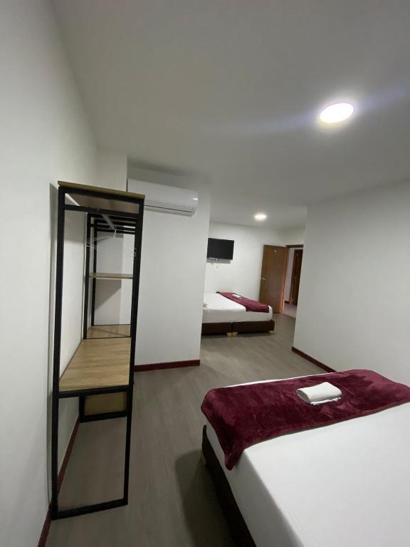 Postel nebo postele na pokoji v ubytování Hotel Gallery By 70