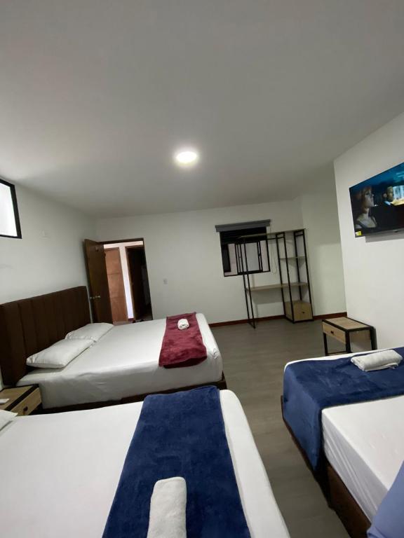 Postel nebo postele na pokoji v ubytování Hotel Gallery By 70