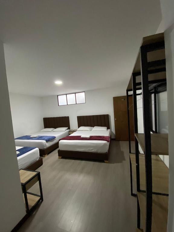 Postel nebo postele na pokoji v ubytování Hotel Gallery By 70