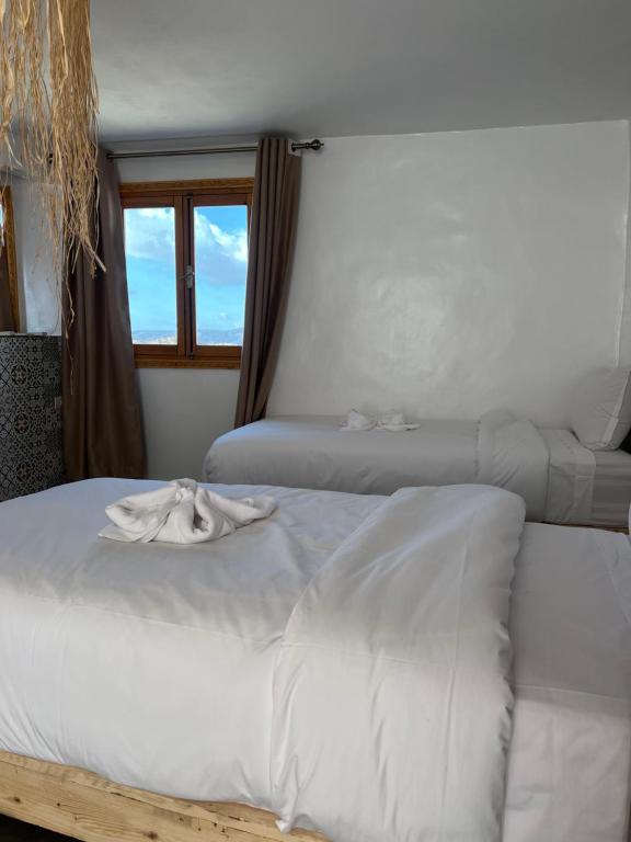 Postel nebo postele na pokoji v ubytování Single fin taghazout surf & stay