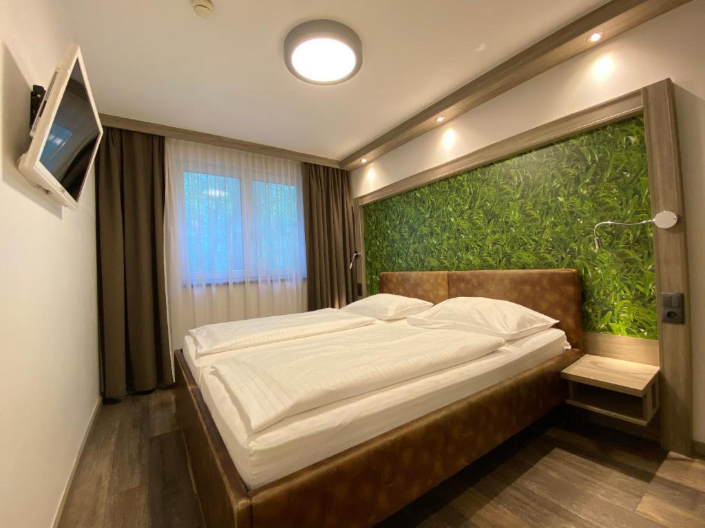 Posteľ alebo postele v izbe v ubytovaní Smart Hotel Schönbrunn