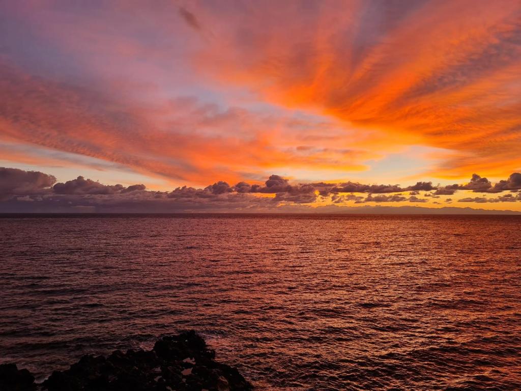 a sunset over a large body of water at Casa Marlene Luxury SeaFront in Güimar