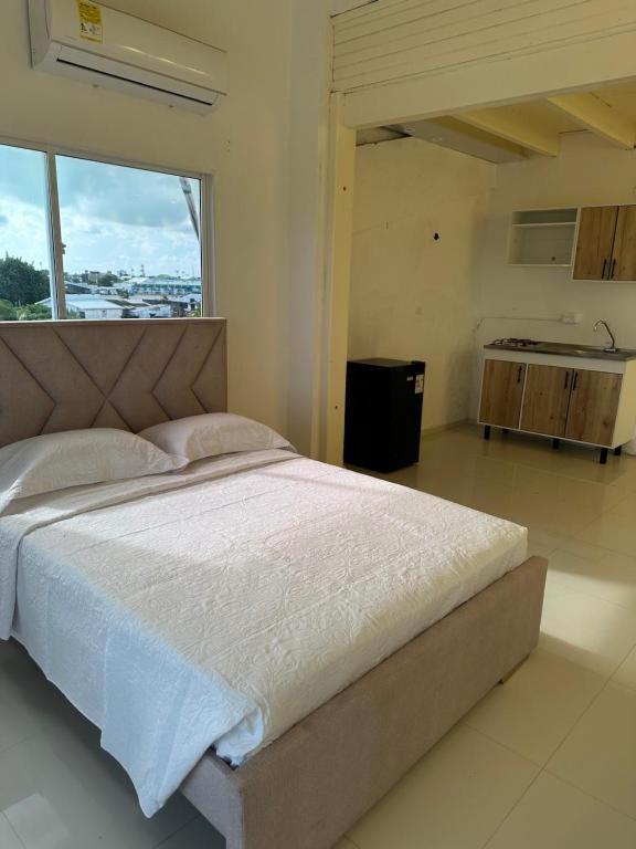 Postel nebo postele na pokoji v ubytování Jhonny Cay Collection Apartahotel