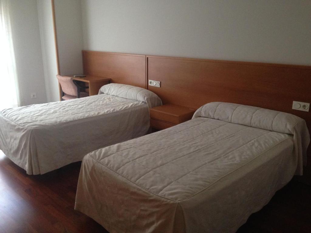 Posteľ alebo postele v izbe v ubytovaní Hostal El Poligono
