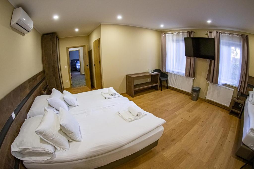 Postel nebo postele na pokoji v ubytování OM Apartman