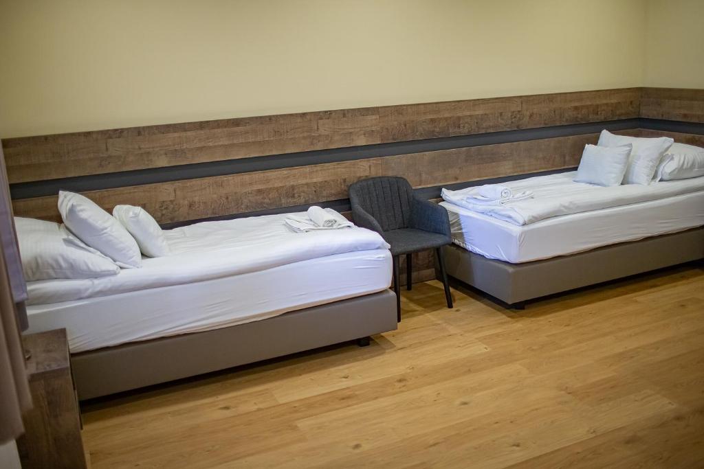 Postel nebo postele na pokoji v ubytování OM Apartman