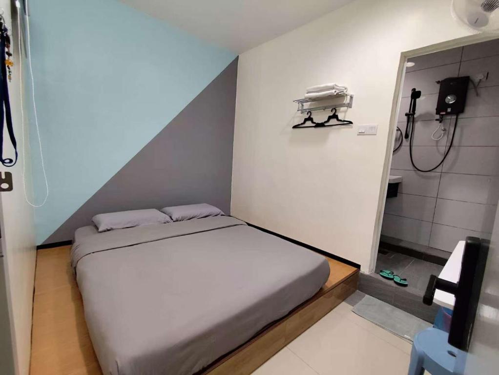 Postel nebo postele na pokoji v ubytování MUSANG ONG HOTEL