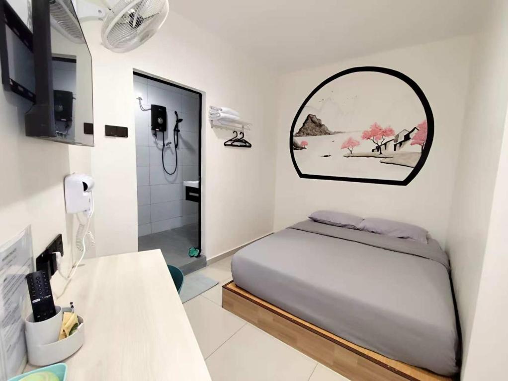 Postel nebo postele na pokoji v ubytování MUSANG ONG HOTEL
