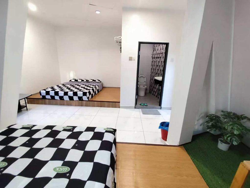 Postel nebo postele na pokoji v ubytování MUSANG ONG HOTEL