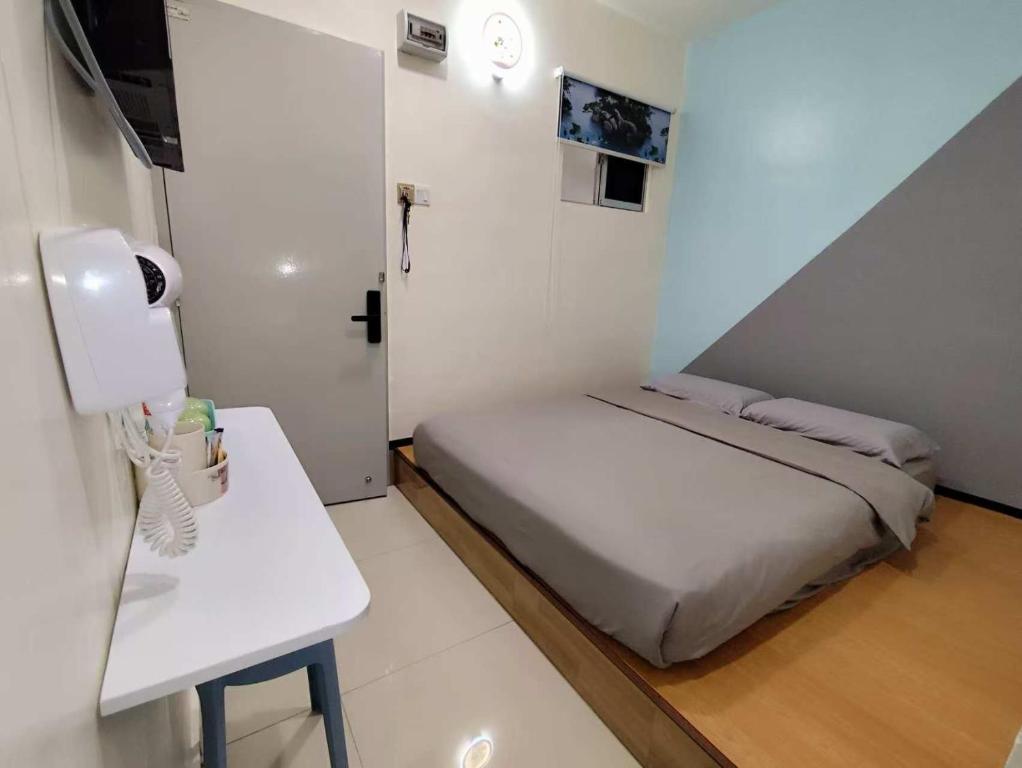 Postel nebo postele na pokoji v ubytování MUSANG ONG HOTEL
