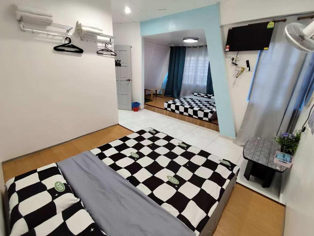 Postel nebo postele na pokoji v ubytování MUSANG ONG HOTEL