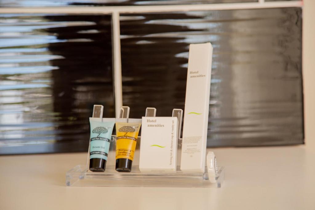 a display of three products on a table at Poseidon Apartments and Villas by the Sea in Sounio